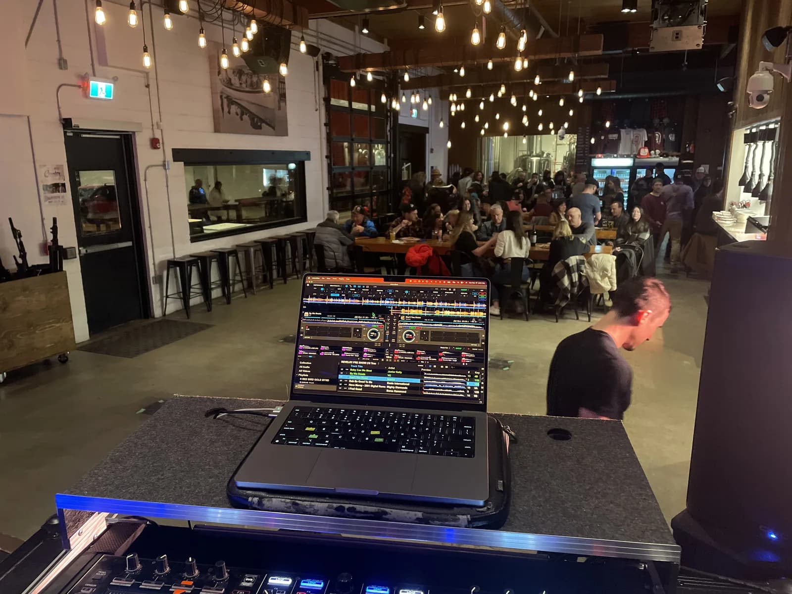 Wedding DJ view of a lively reception dance floor with guests dancing